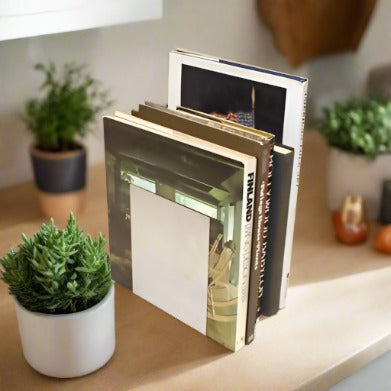 chrome-colored metal bookends by Another McDonald Design Buffalo, N.Y