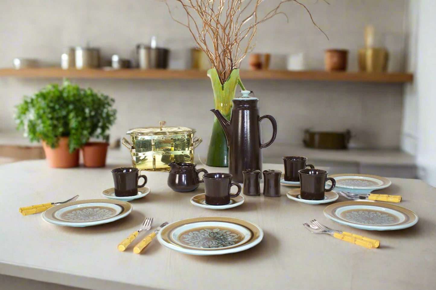 Vintage Stoneware brown and teal in color with Coffee mugs , saucers, creamer bowl, Dinner plates and a coffee pitcher.