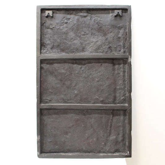 BAck of resin and glass artwork of large green leaves