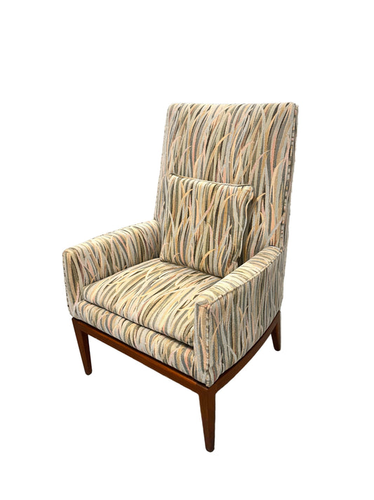 Tall back upholstered arm chair with pastel reeds design