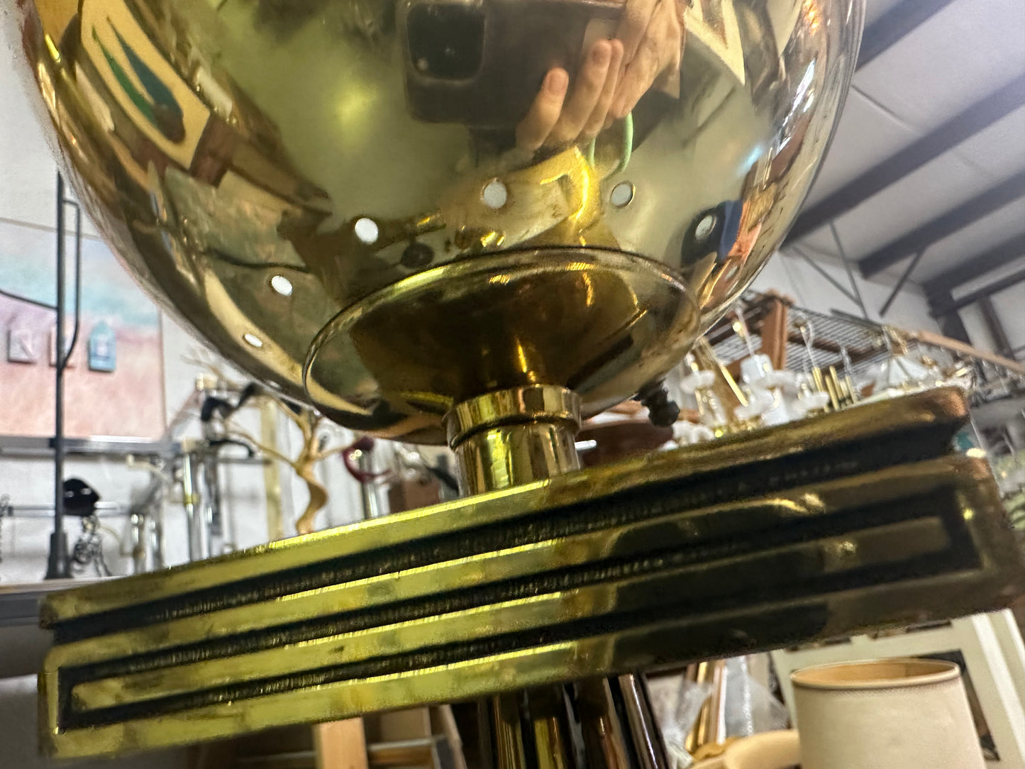 Close-up of a brass lamp with a blurred background