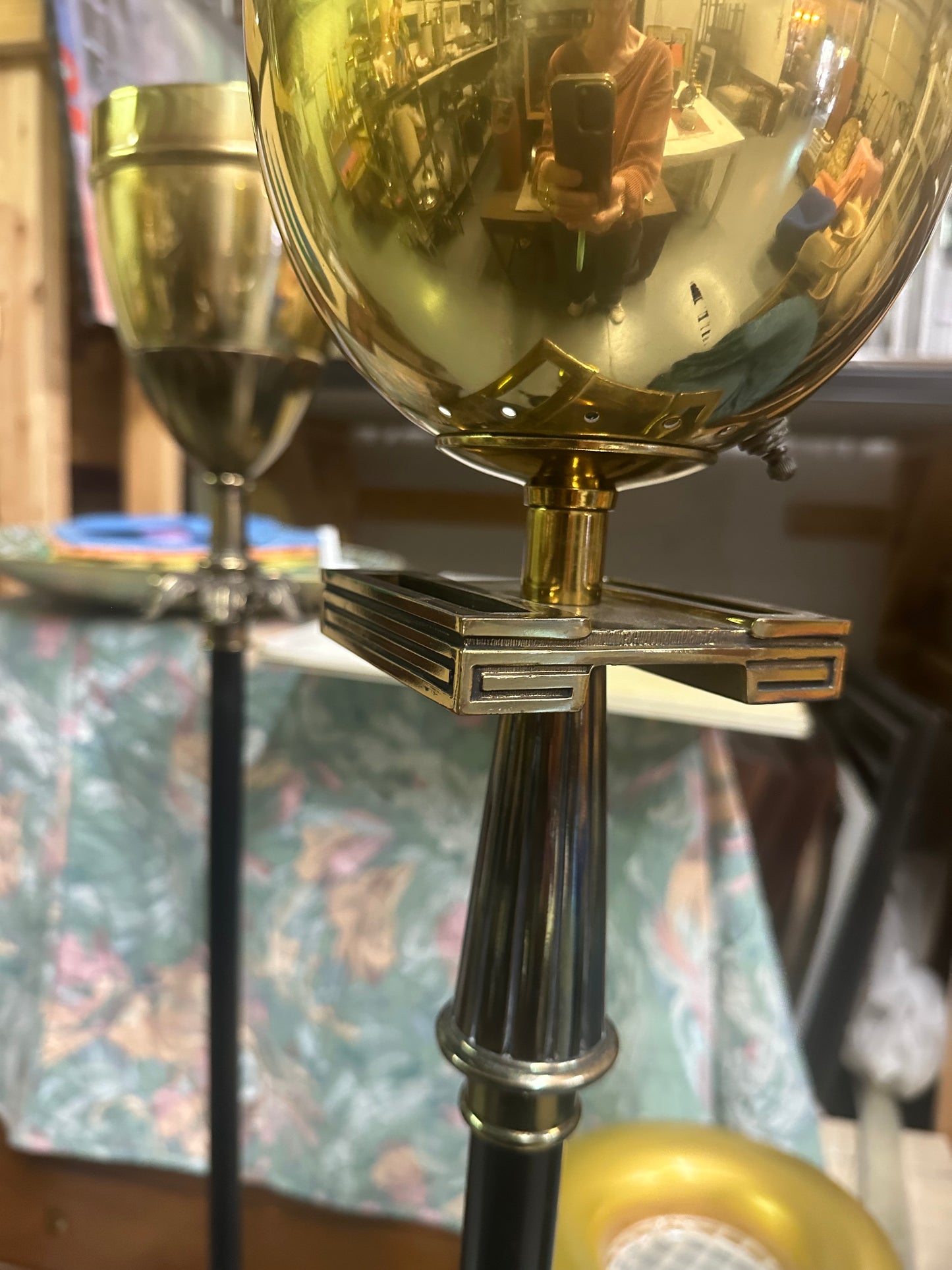 Close-up of a decorative object with gold and silver elements on a patterned background