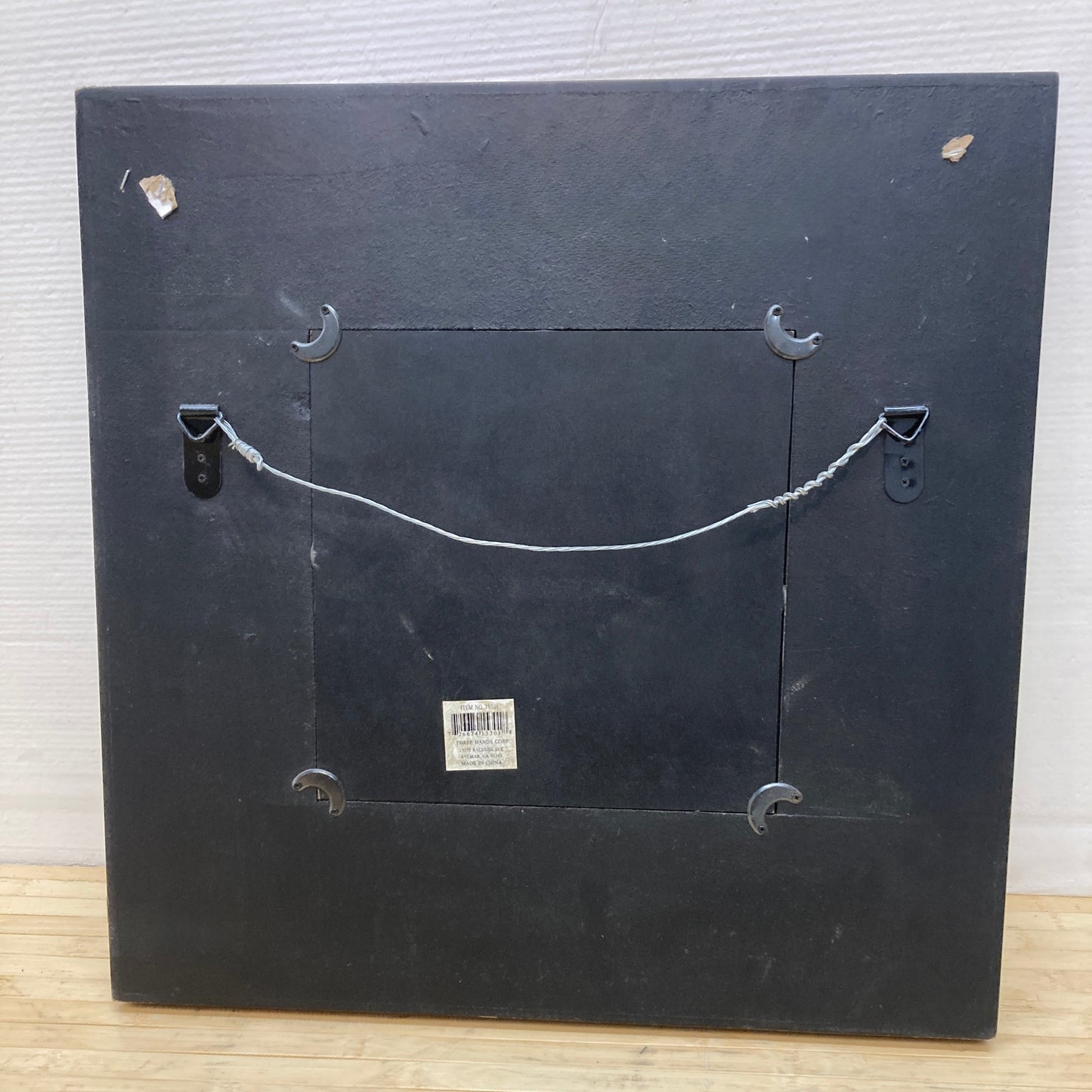 Geometric mirror with a copper-toned frame.