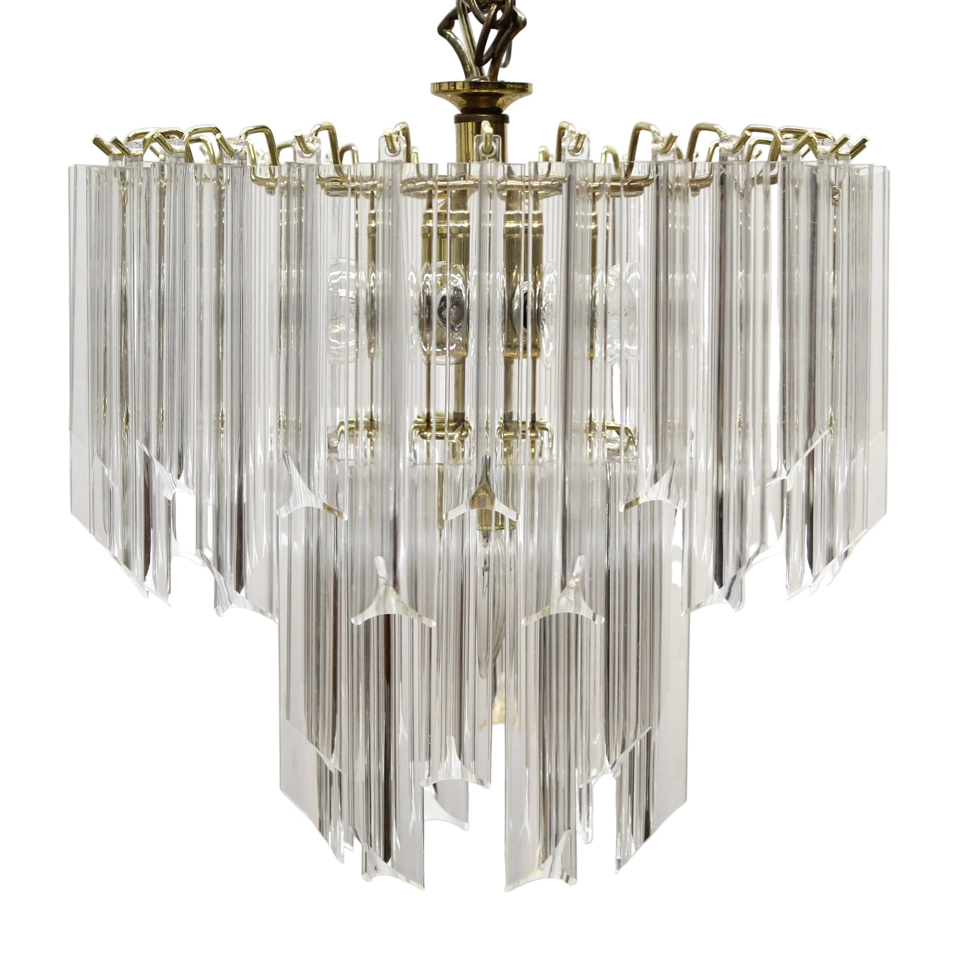 Decorative chandelier with clear glass elements and gold accents on a white background