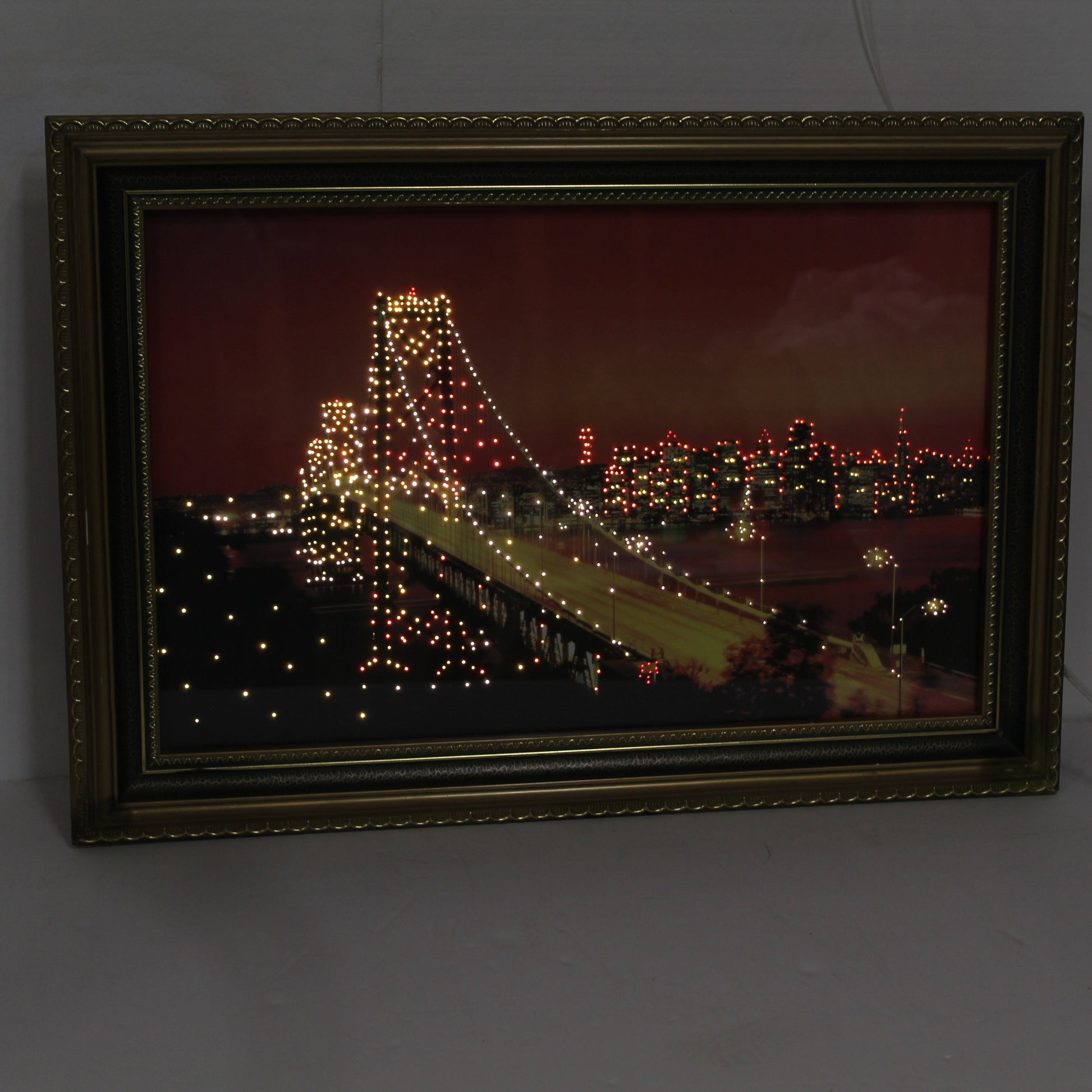 Close-up of the lighted cables on a vintage SF Bay Bridge moving picture. Internal motorized lights create a sparkling twinkle