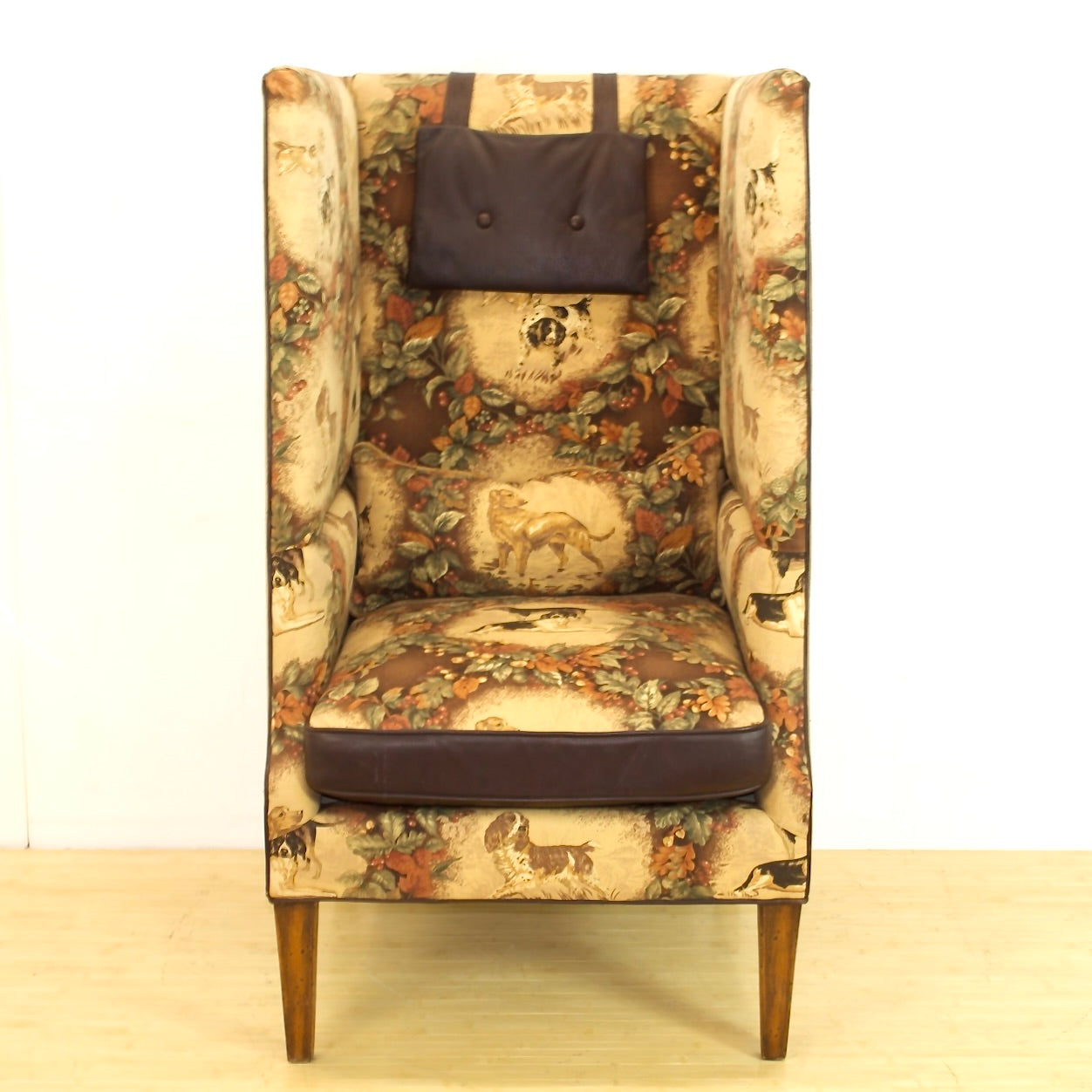 Privacy Chair with old world style bird dog and nature themed upholstery with leather accents.