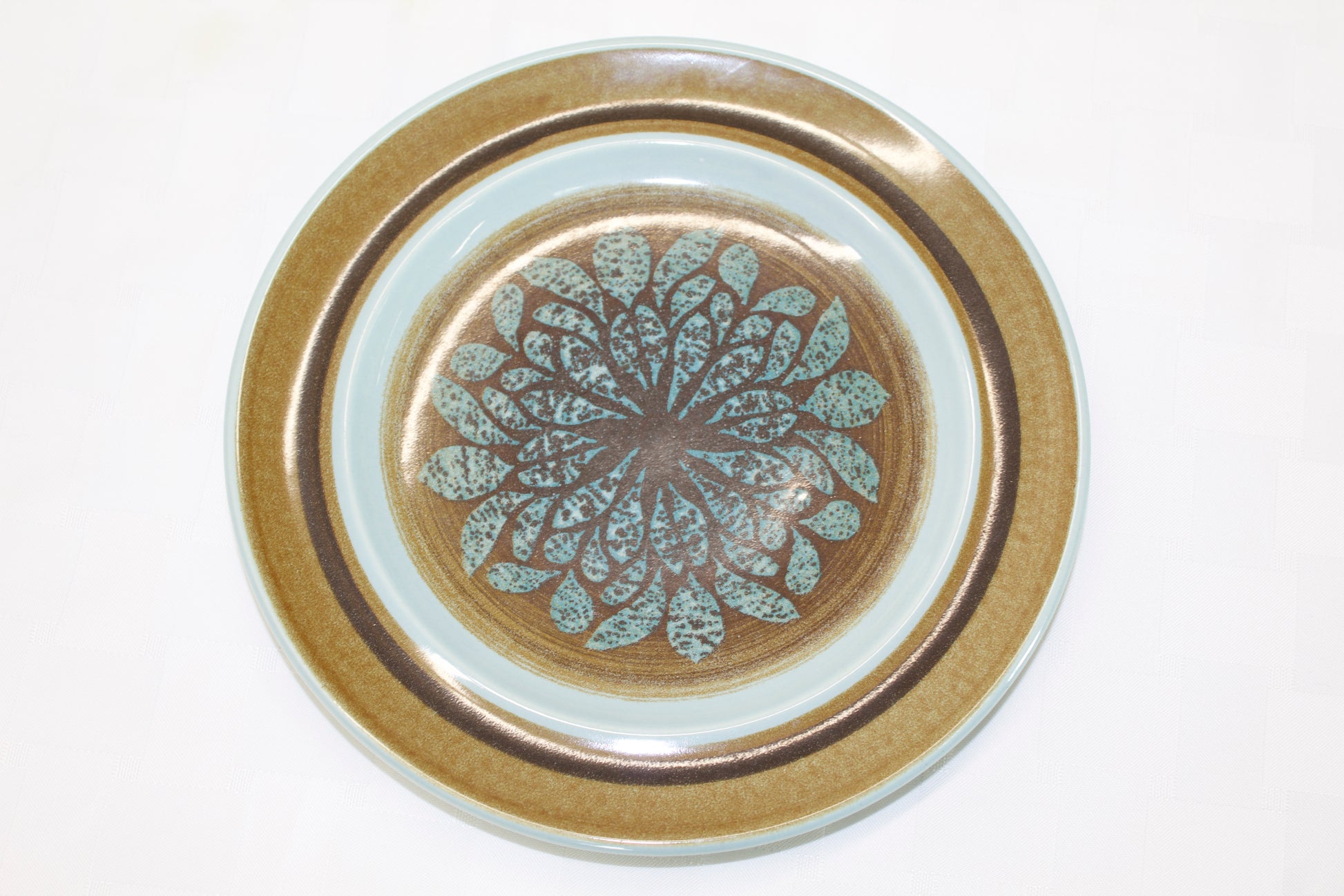 Franciscan Stoneware brown and teal in color with a leaf design 