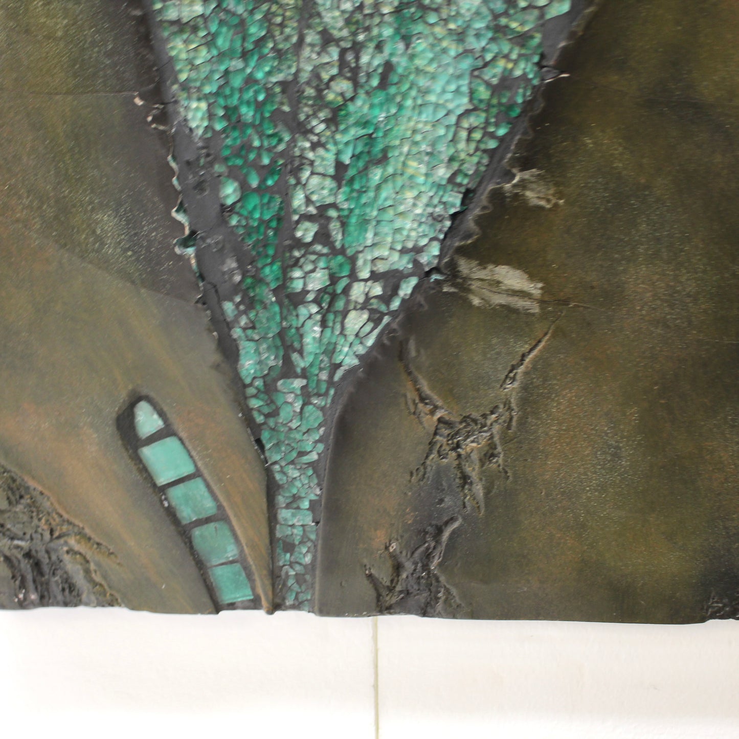 Close-up of a leaf image made of textured glass in green 