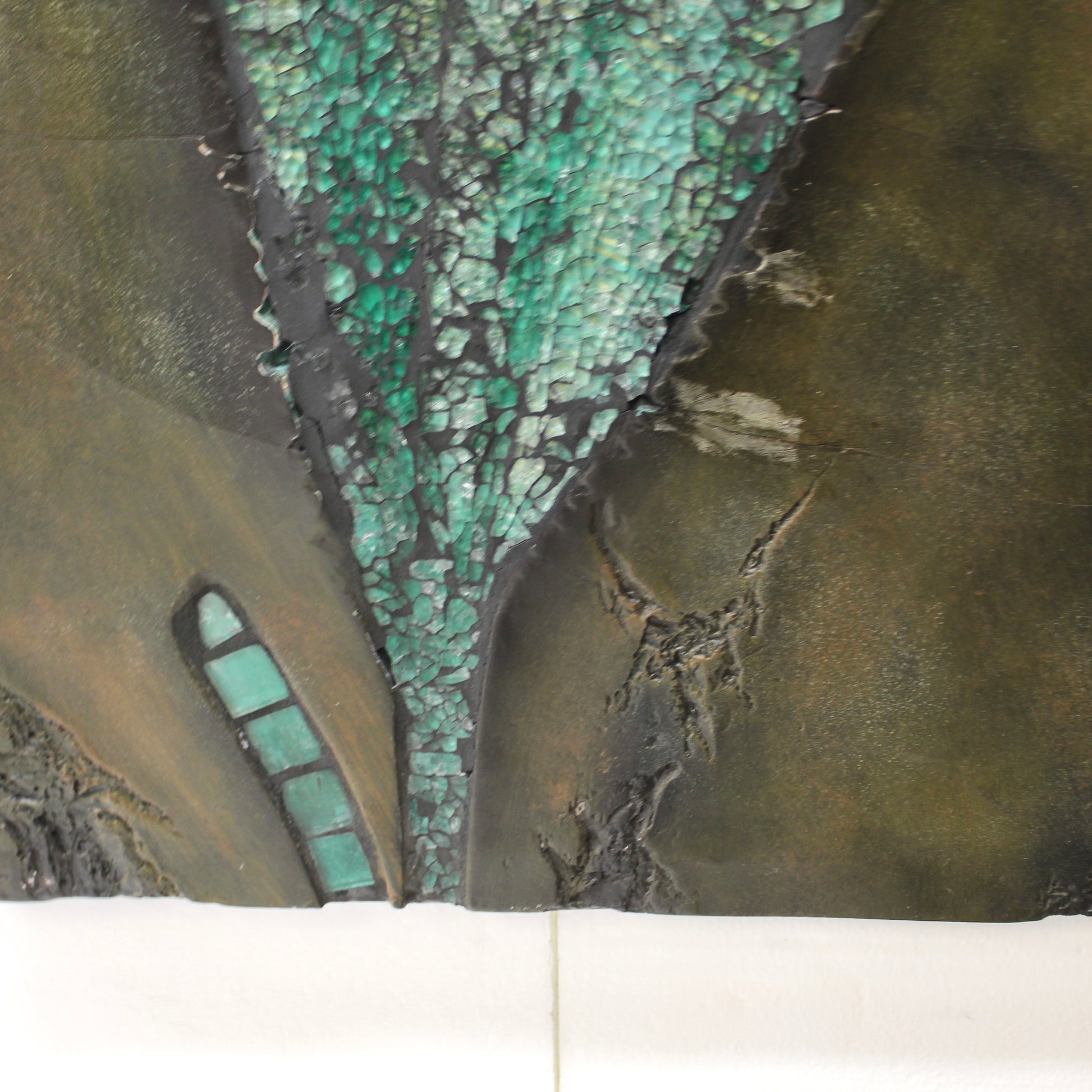 Close-up of a leaf image made of textured glass in green 