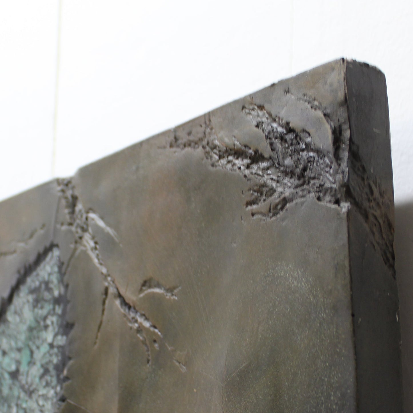 Resin art in a stone lookalike with crushed glass leaves wall art