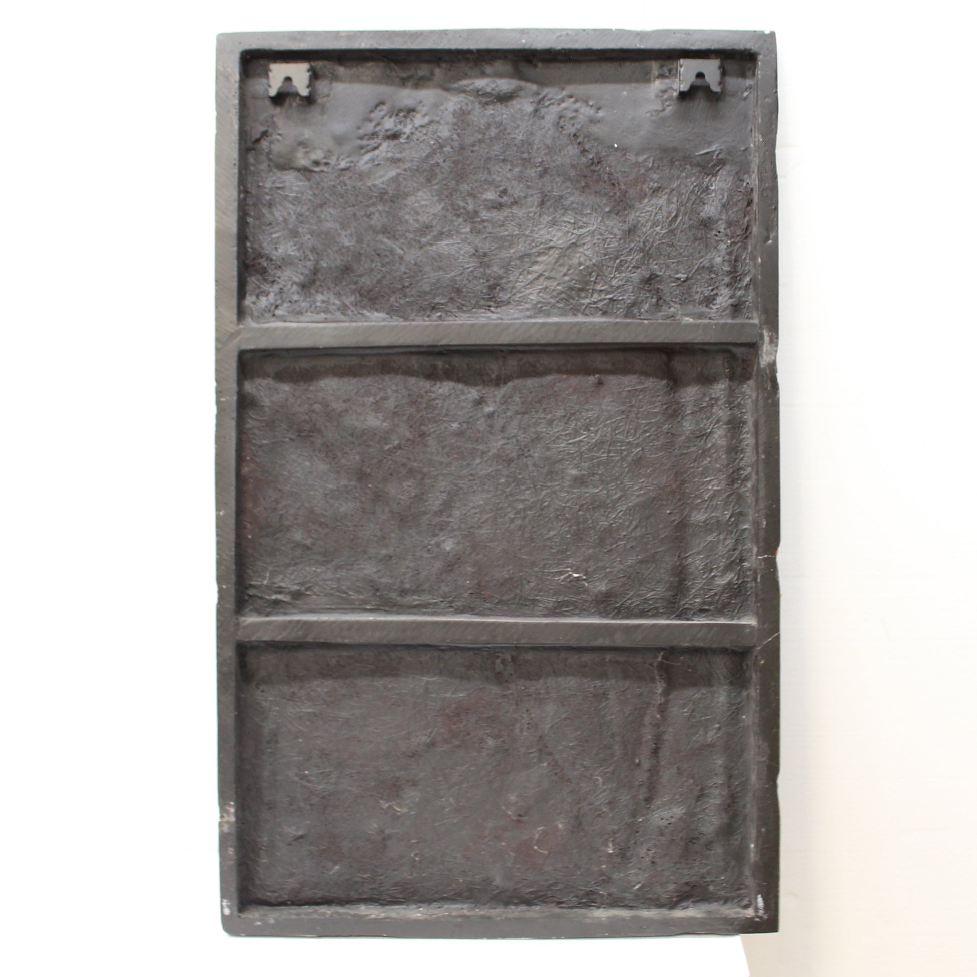 BAck of resin and glass artwork of large green leaves