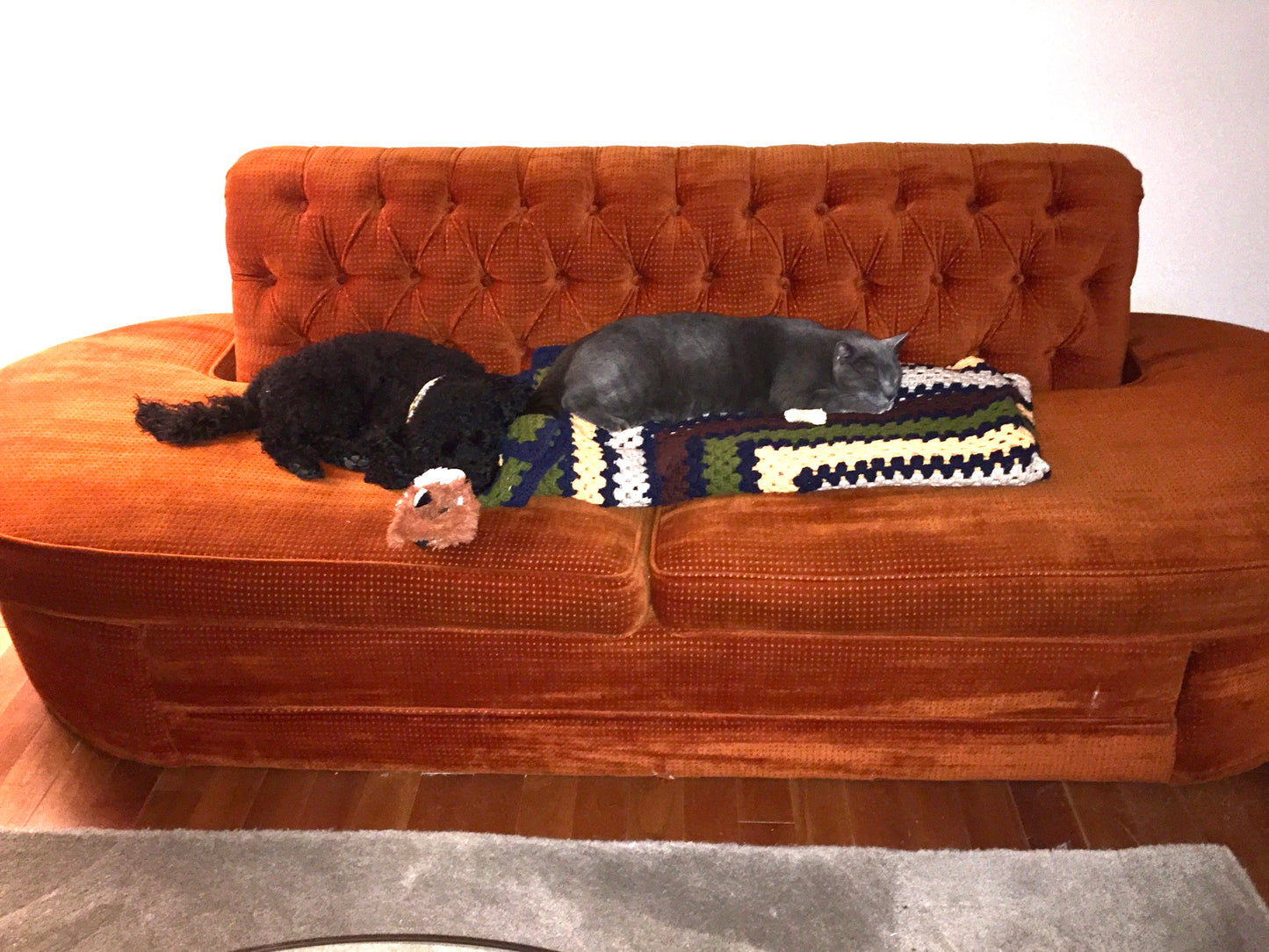 Mid Century Orange Velour Armless Tufted Sofa