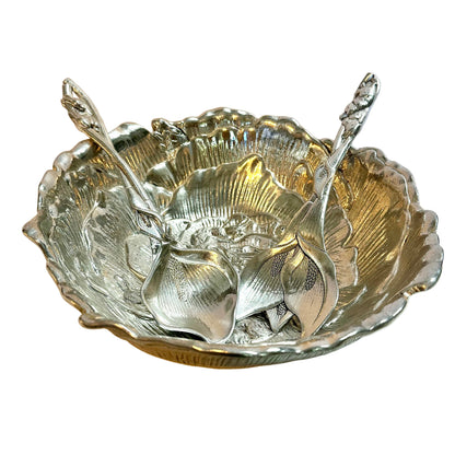 Silver bowl with floral design and two serving spoons designed like plants