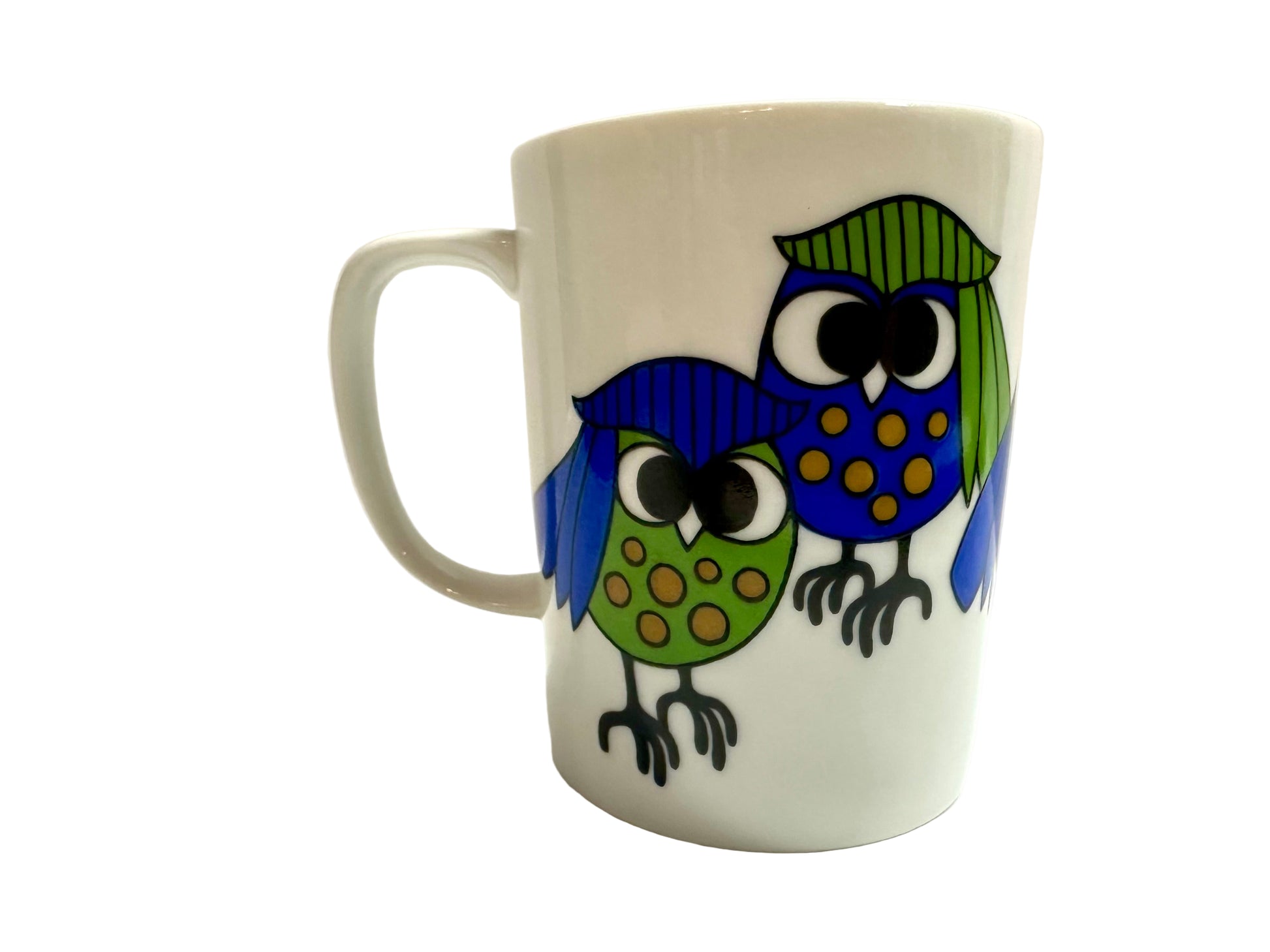 White mug with colorful owl design on a white background