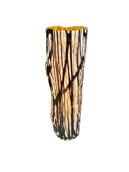 Glass Vase with black and tan striped pattern and knots mimicking a tree trunk
