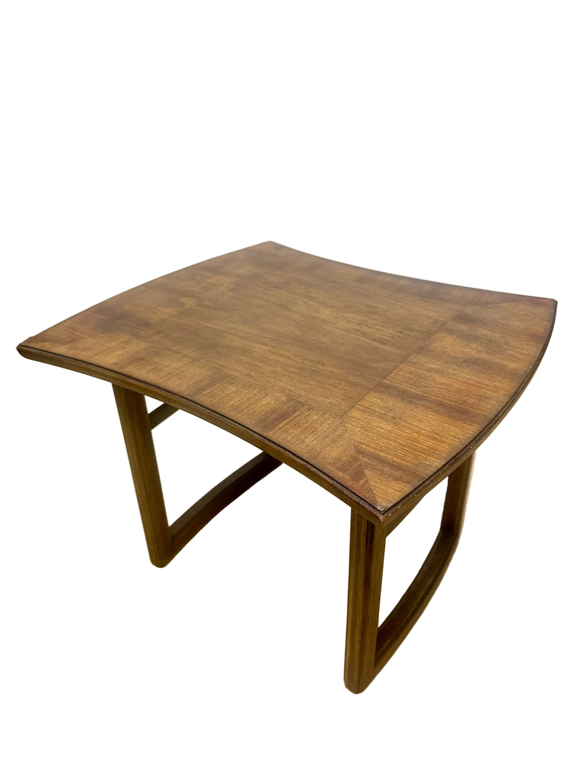 Woodenend  table with a checkered parquet pattern on a wooden floor.