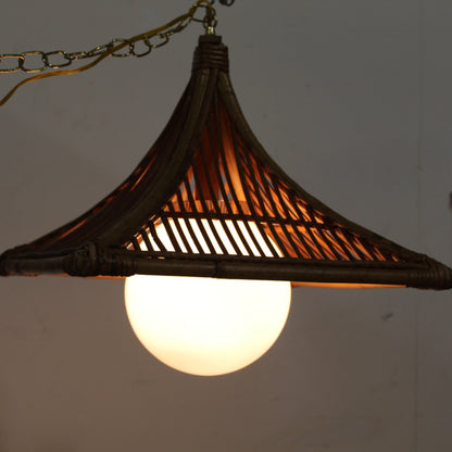 Large square bamboo frame over a white glass orb light. 