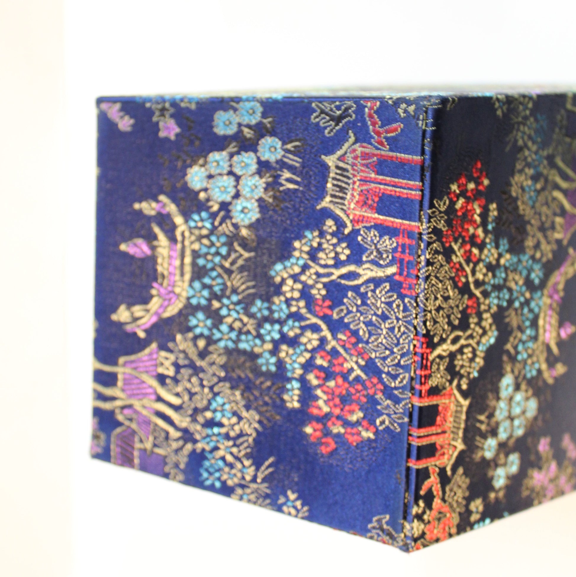 Bottom of Navy blue Chinoiserie brocade square planter. 