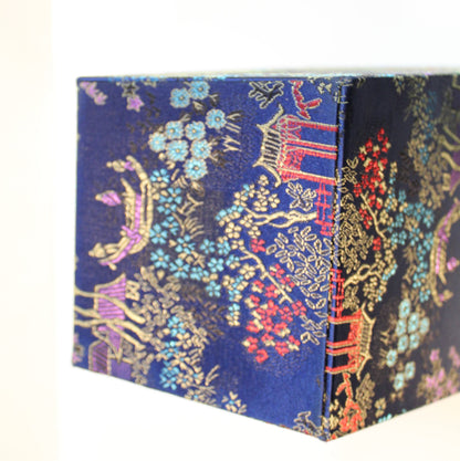 Bottom of Navy blue Chinoiserie brocade square planter. 