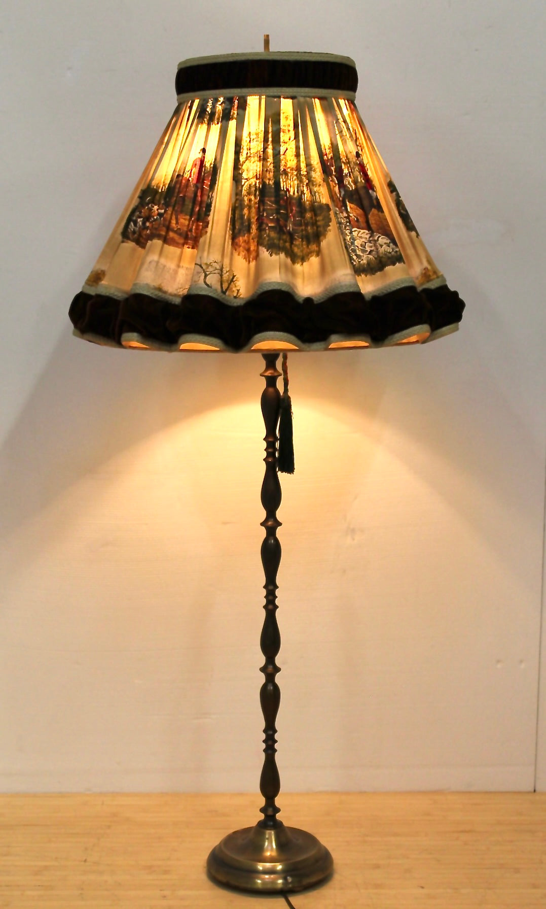 Floor lamp with hunting scene fabric shade.