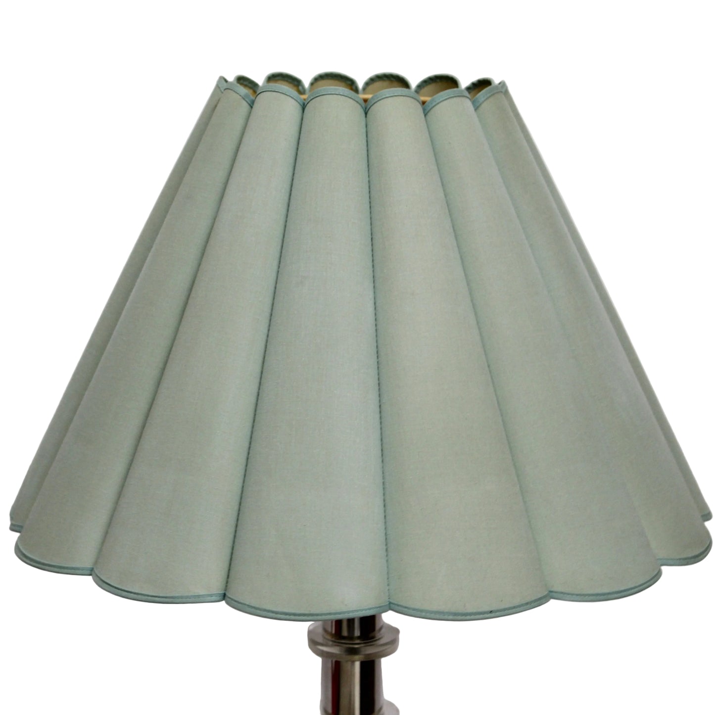 Light green lampshade with pleated design on a white background