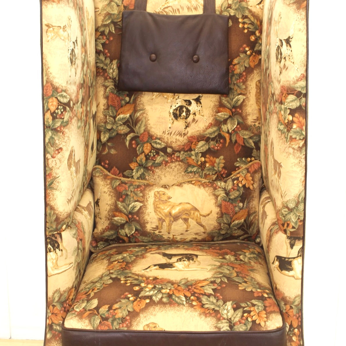 Privacy Chair with old world style bird dog and nature themed upholstery with leather accents.