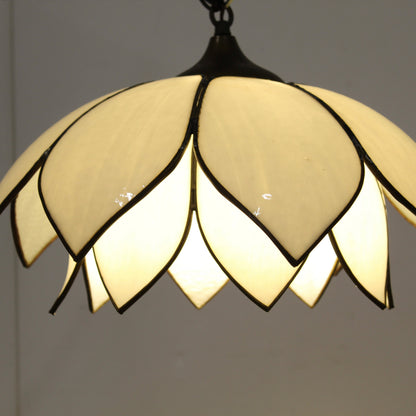 Double-layer tulip or lotus flower motif. The dual tiers of sculpted, milk-white slag glass petals are framed by dark, antiqued metal lead lines.