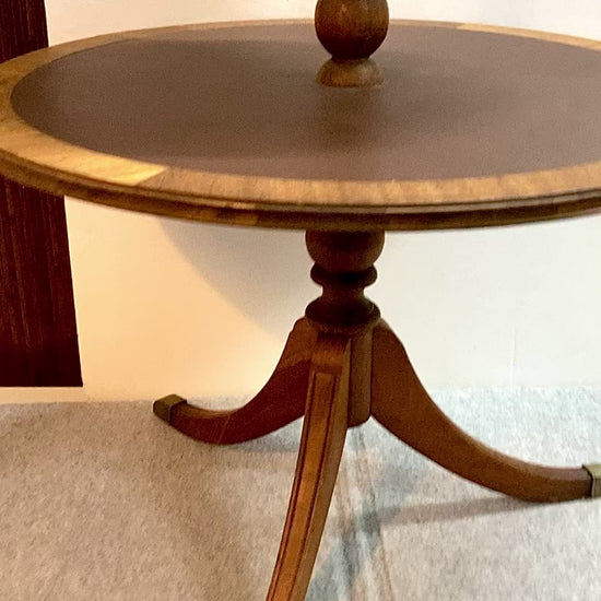 This 2-tier mahogany tripod side table