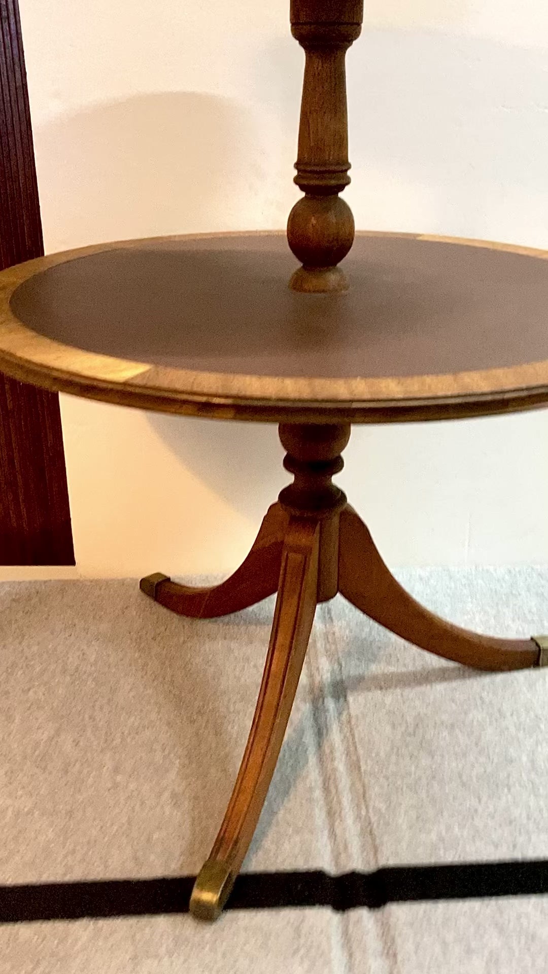 This 2-tier mahogany tripod side table