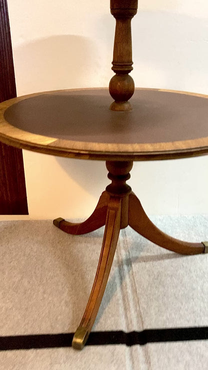 This 2-tier mahogany tripod side table
