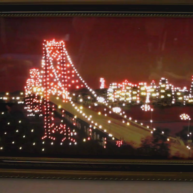 Vintage 80s San Francisco Bay Bridge moving light art. Features a sparkling "twinkle" effect and waving water motion. Perfect retro SF skyline decor for collectors.