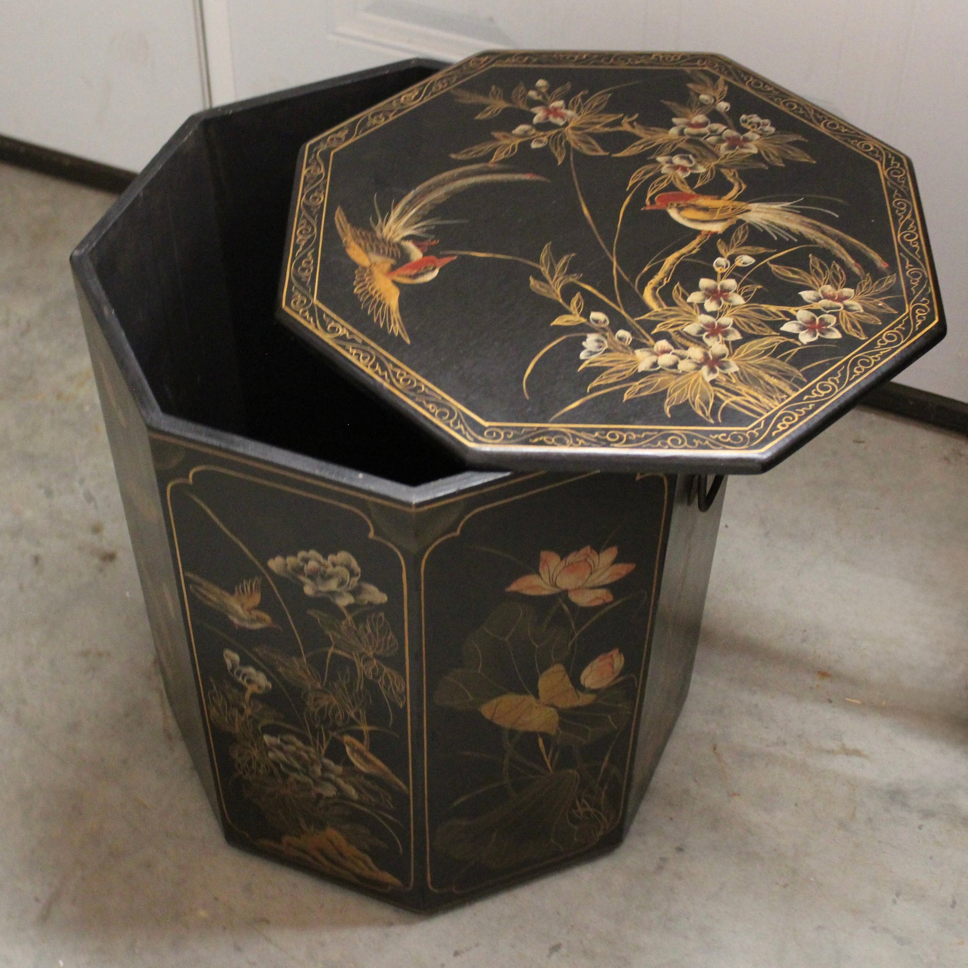 vintage Asian-inspired octagonal wastepaper basket features a deep black lacquer finish decorated with hand-painted gold and polychrome gilt motifs.